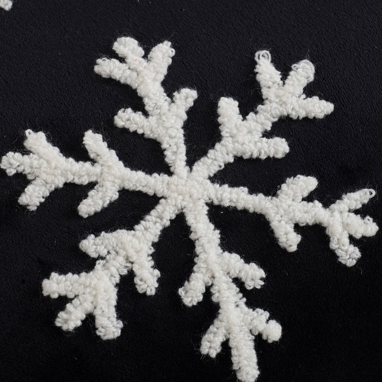 Embroidered white snowflake on black fabric cozy winter accent