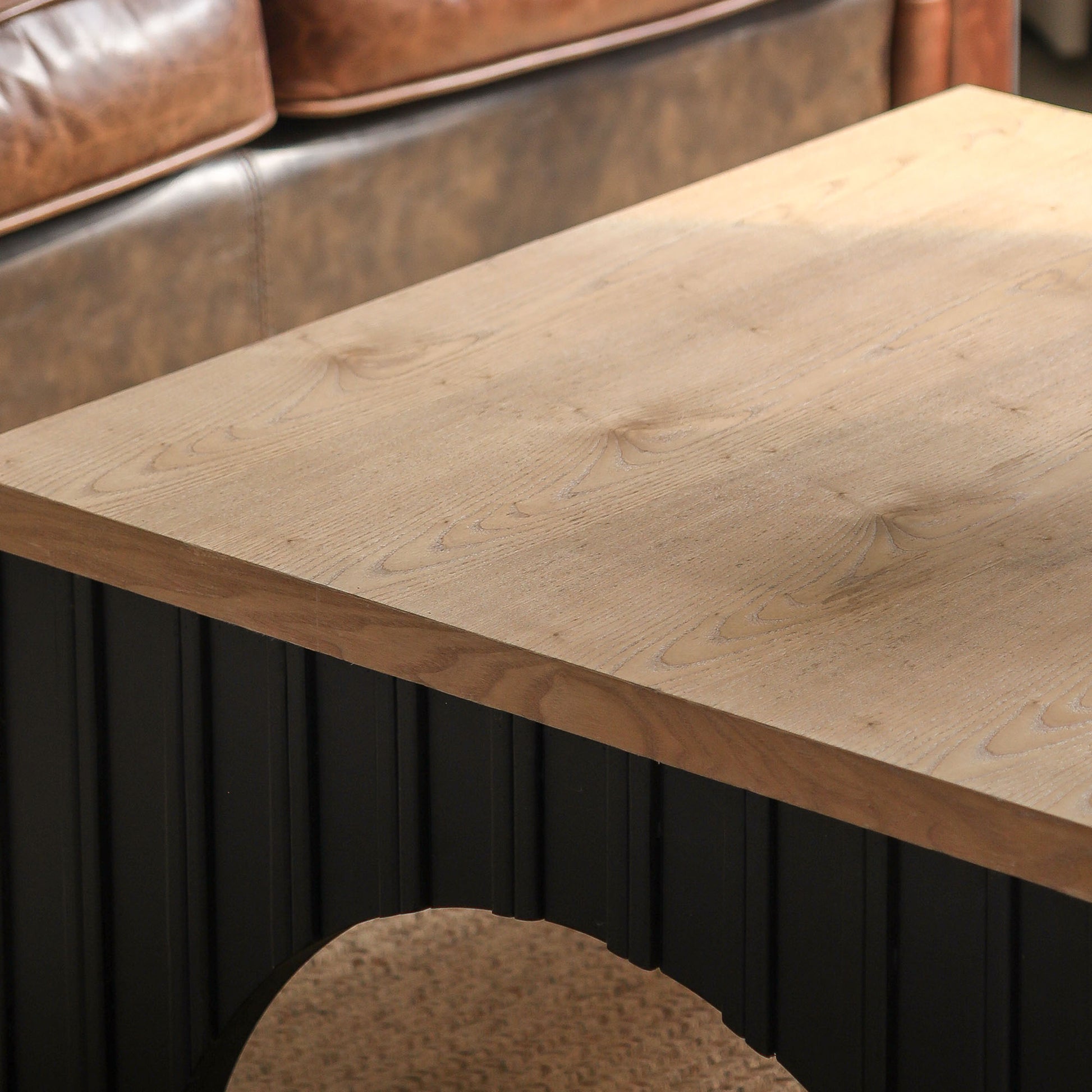 Rustic oak wood top coffee table with black ribbed base