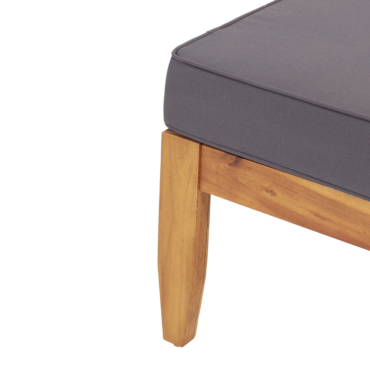 Dark gray tufted cushion on natural wood ottoman base closeup shot