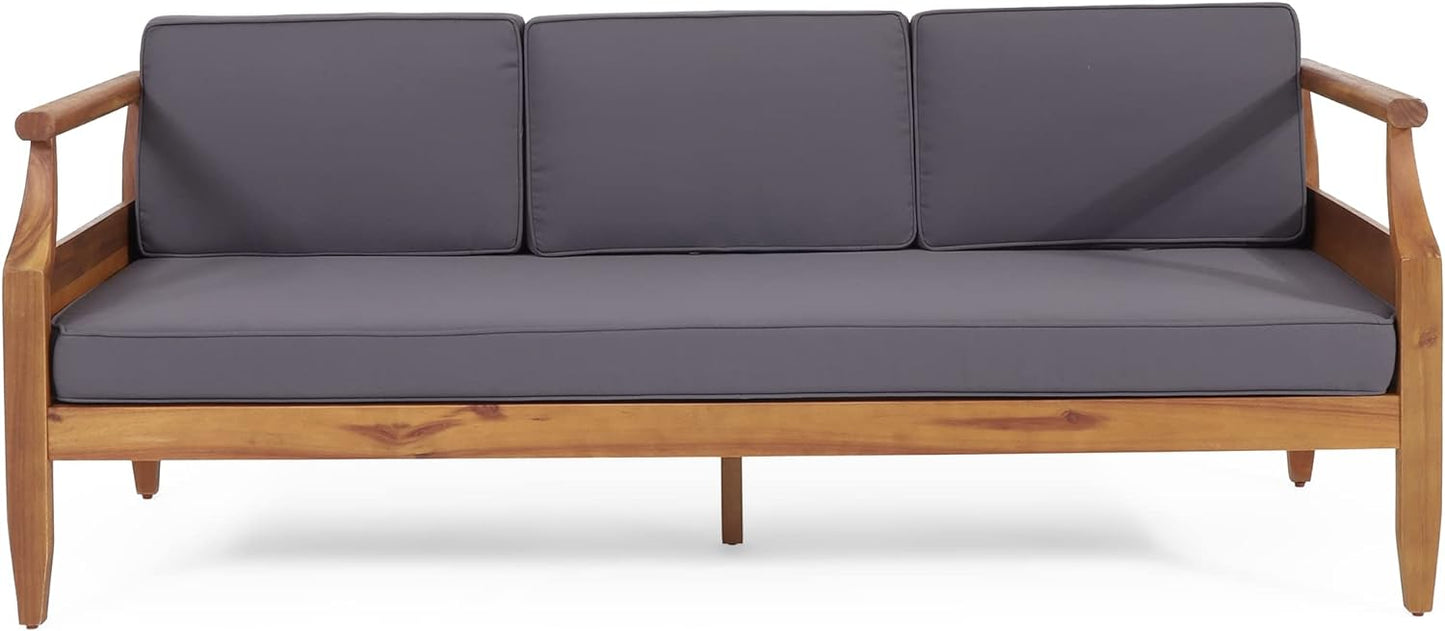 Threeseater wooden outdoor sofa with charcoal grey cushions perfect for patio lounging