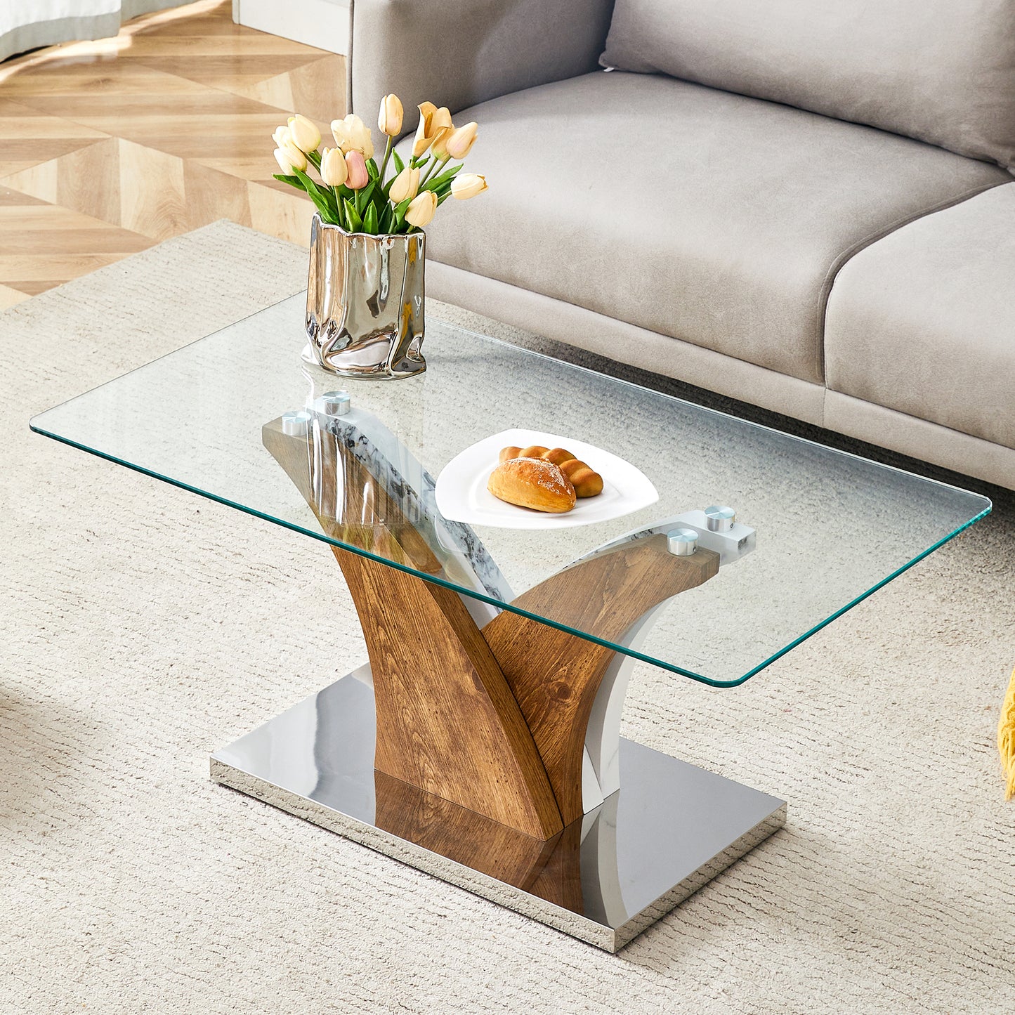 Modern glass coffee table with wooden and chrome pedestal base perfect for living rooms