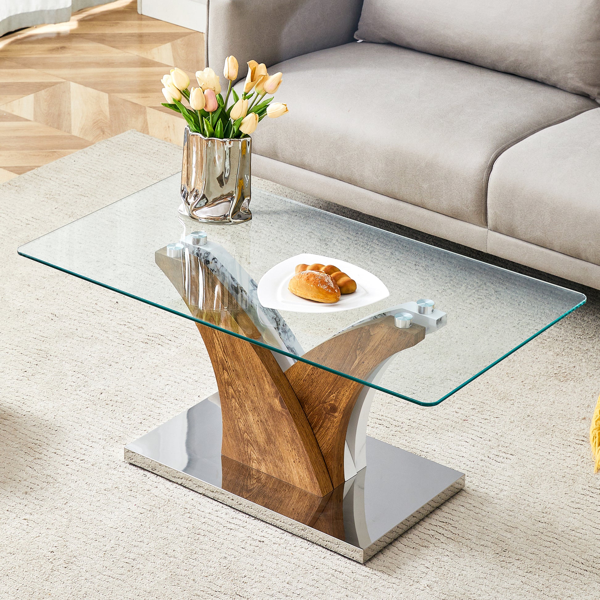 Modern glass coffee table with wooden and chrome pedestal base perfect for living rooms