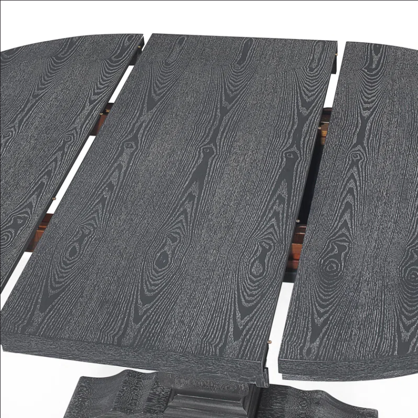 Closeup of dark gray woodgrain extending dining table top