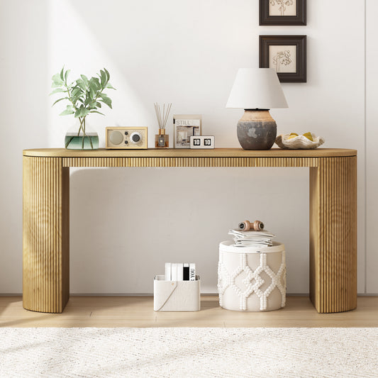 Curved natural wood console table with fluted side detail ideal for modern entryways
