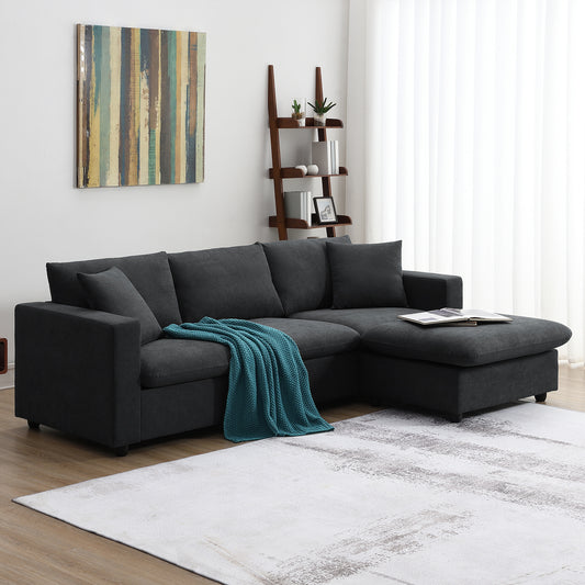 Dark gray sectional sofa with chaise teal throw and abstract art