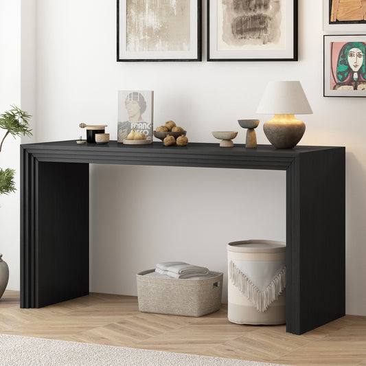 Sleek black entryway console table with fluted side panels and minimalist design