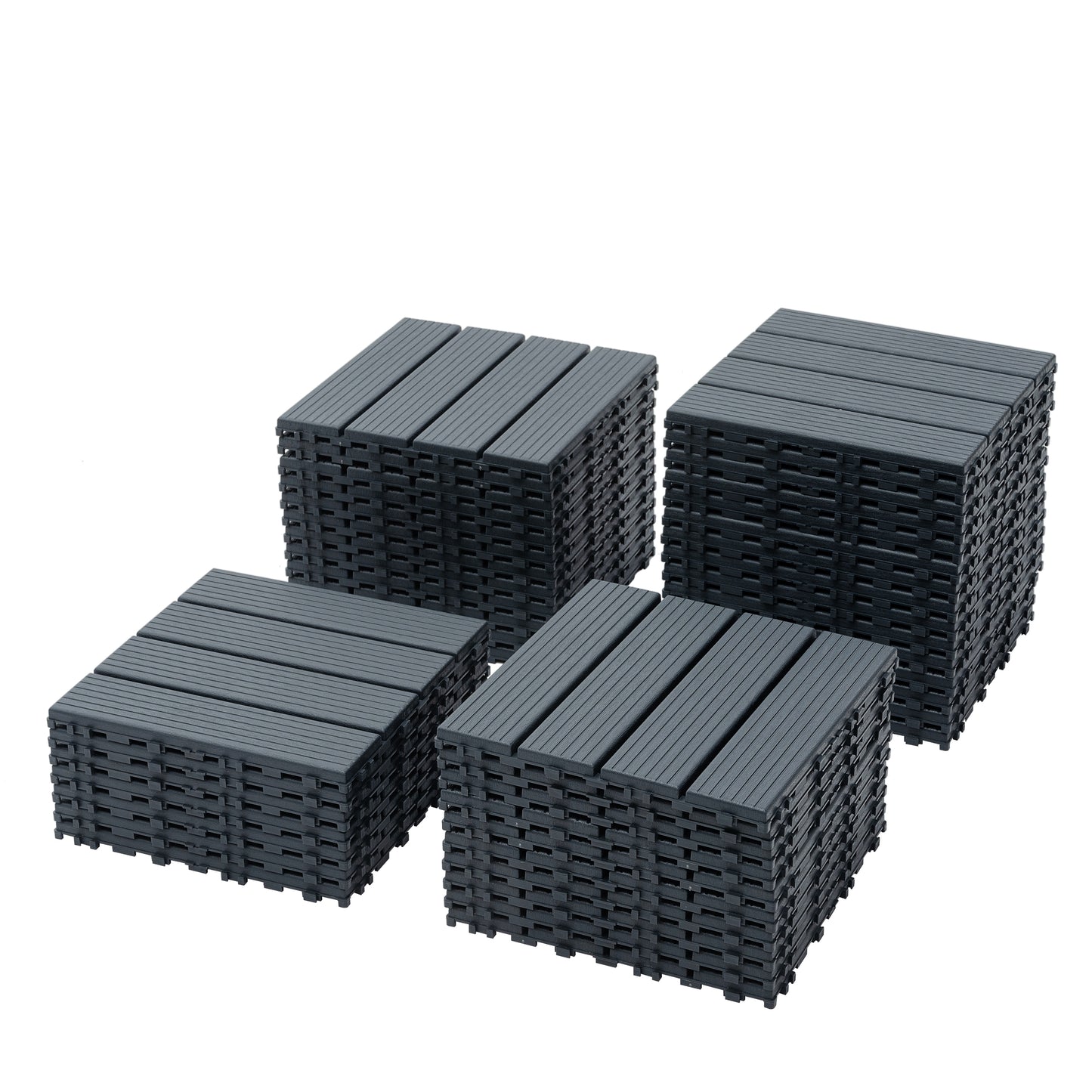 Four stacks of dark grey composite deck tiles with a grooved surface