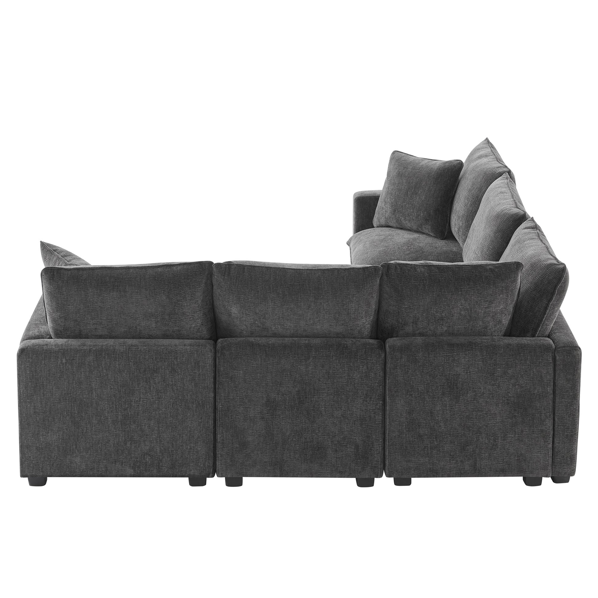 Deep charcoal grey sectional sofa with plush fabric and loose back cushions