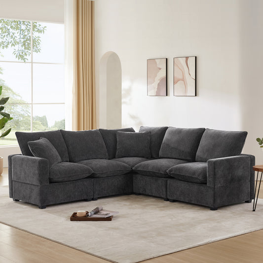 Plush charcoal gray sectional sofa with deep seats and multiple throw pillows