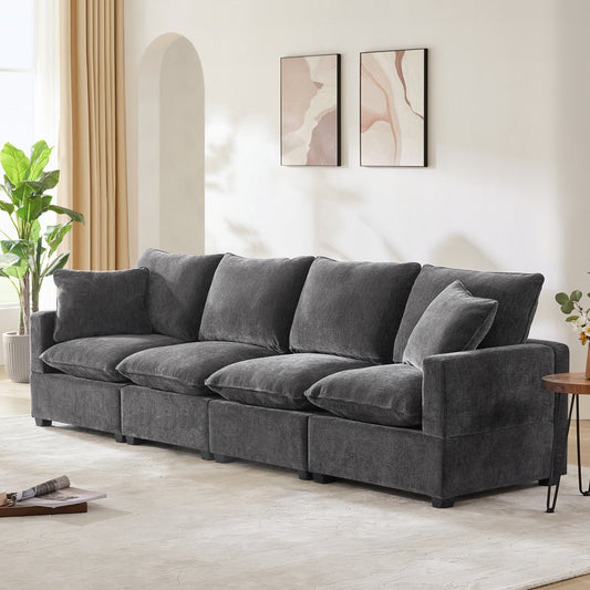 Deep charcoal gray sectional sofa with plush fabric and oversized cushions