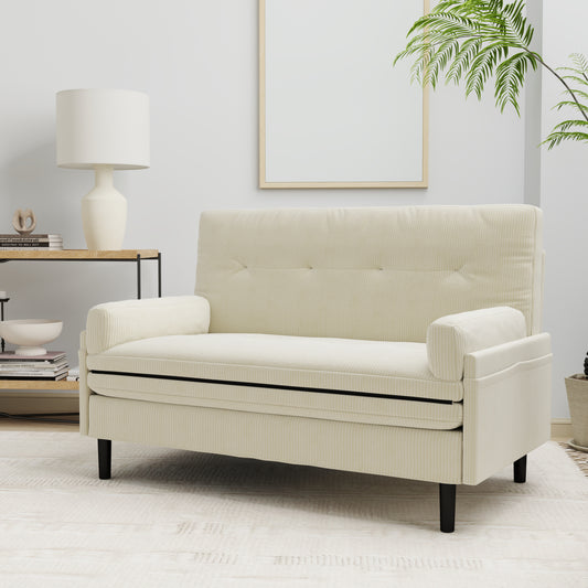 Cream corduroy loveseat with tufted back and black legs