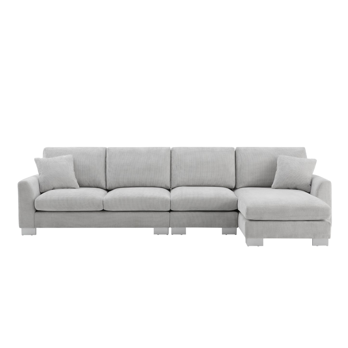 Light grey fabric sectional sofa with modern silver legs and two accent pillows for living room comfort