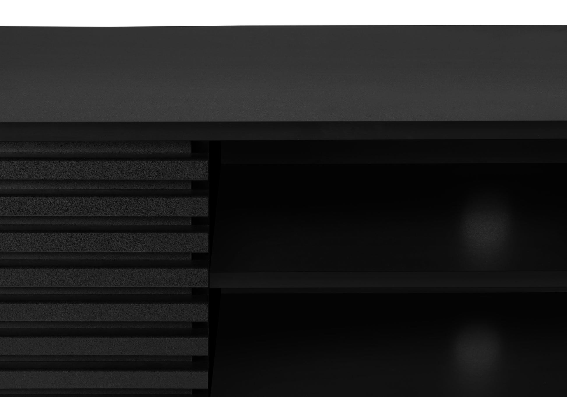 Closeup of a black modern media console with horizontal ribbed panel detail