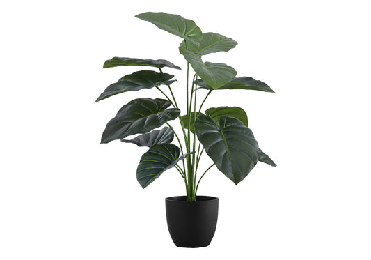 Large artificial elephant ear plant with dark green textured leaves in a black planter