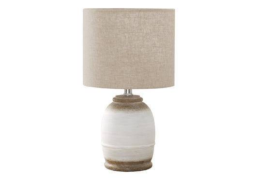 Rustic ceramic table lamp with a textured offwhite base and beige linen shade