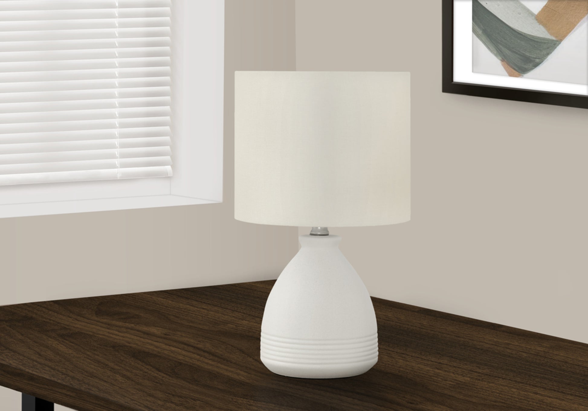 White ceramic table lamp with offwhite drum shade ribbed base