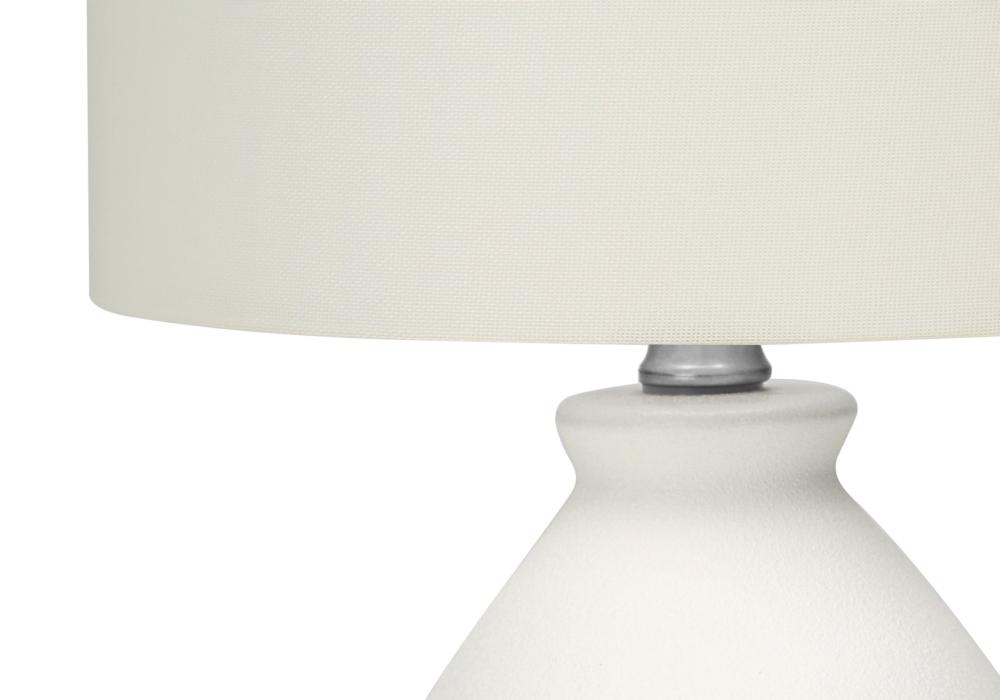 White textured ceramic table lamp with a cream fabric shade