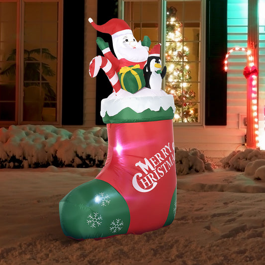 Red and green inflatable Christmas stocking with Santa penguin gift and candy cane decoration