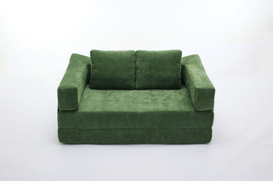 Green velvet sofa bed with two plush cushions ideal for small spaces