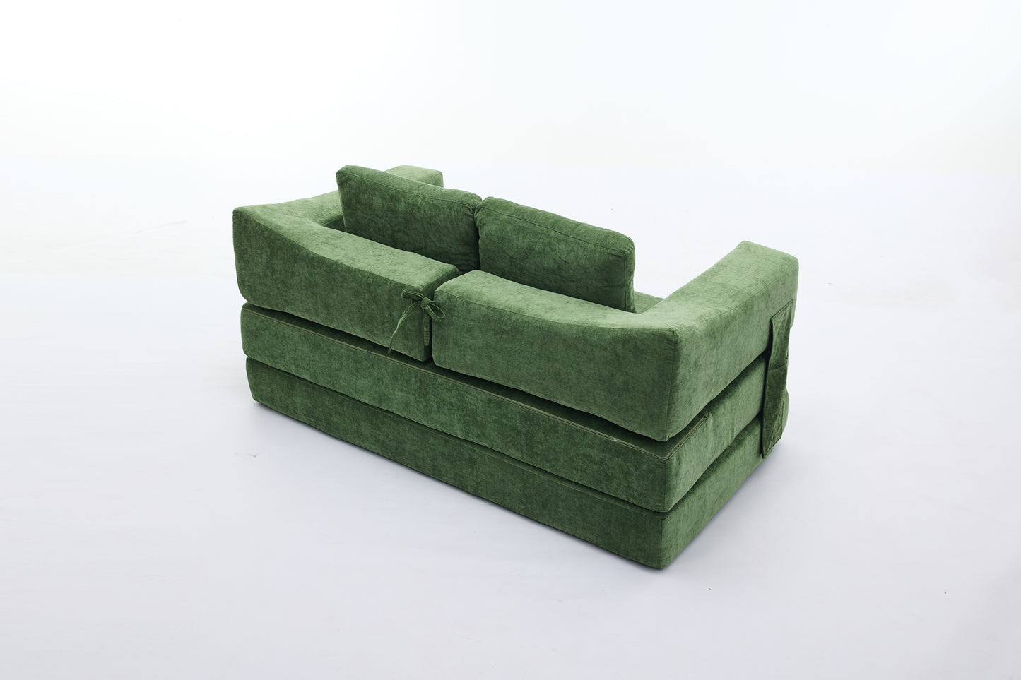 Green velvet modular sofa with stacked cushion design and tie accent