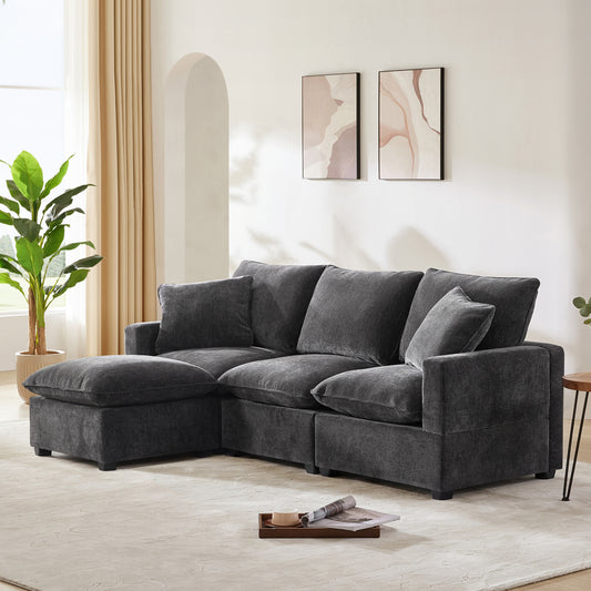 Dark gray sectional sofa with plush cushions and chaise lounge