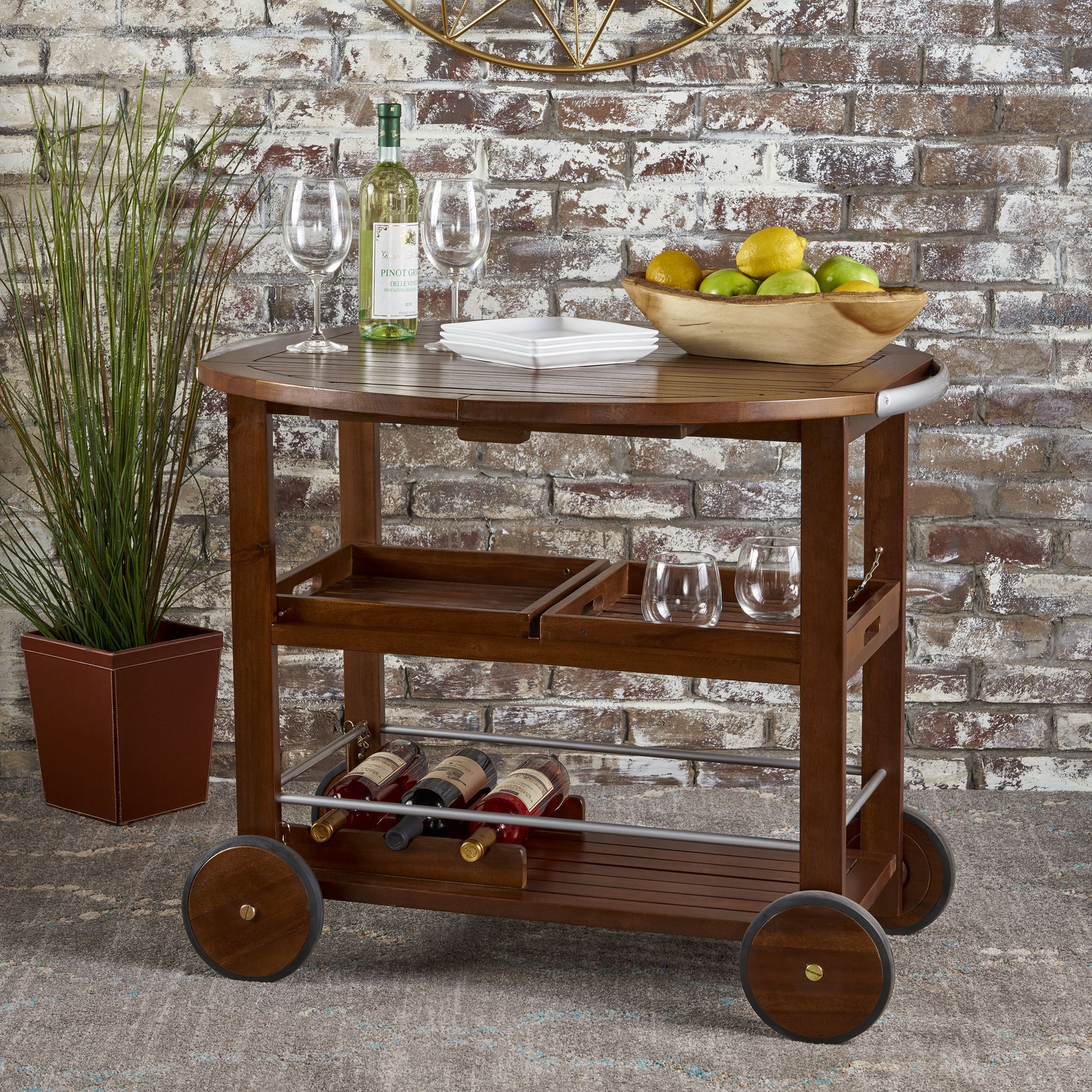 Wooden bar cart with tiered shelves and wine rack perfect for serving drinks