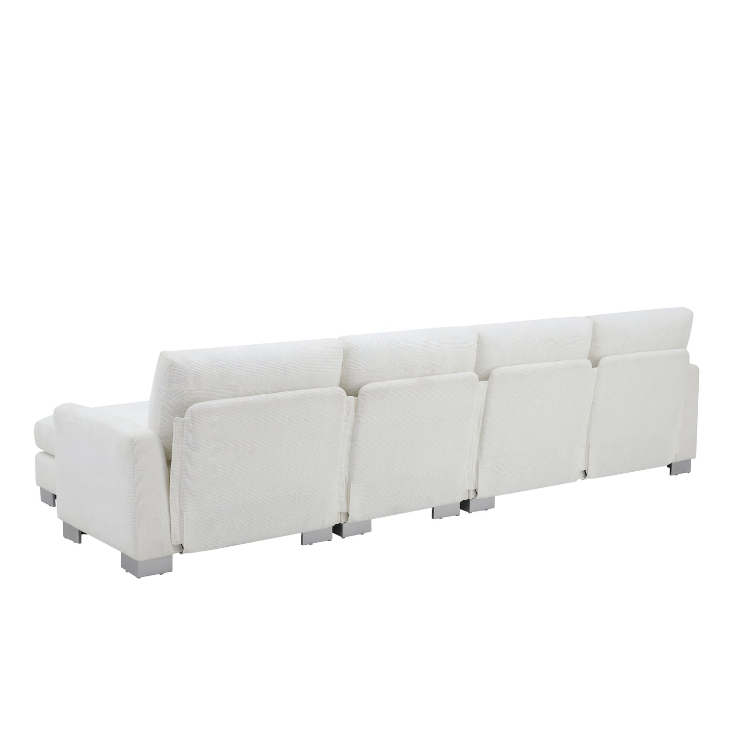 Rear view of a plush white fabric sectional sofa with modern silver legs