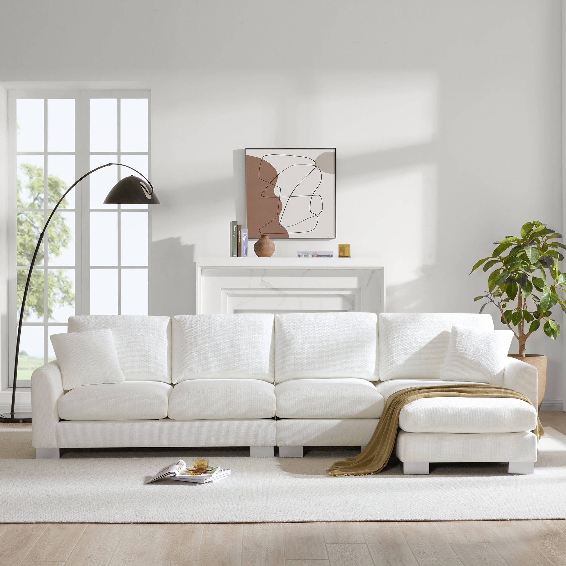Plush white sectional sofa with chaise perfect for modern living rooms