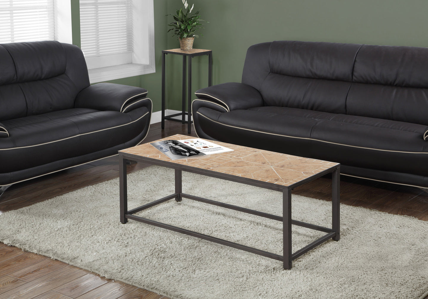 Modern rectangular coffee table with a marblepatterned ceramic top and dark metal frame