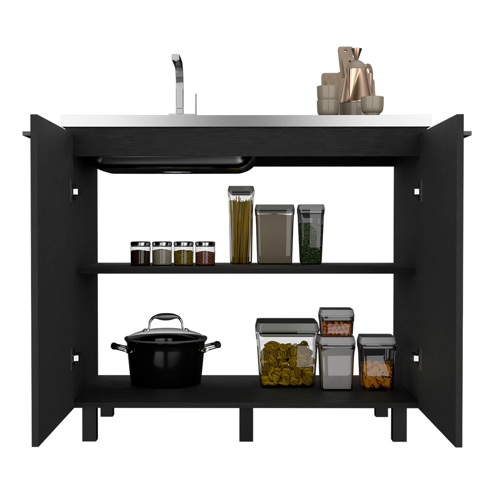 Open black kitchen cabinet with organized pantry essentials pots and a sink