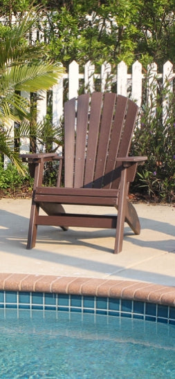 Dark brown Adirondack chair made of durable recycled plastic perfect for poolside relaxation