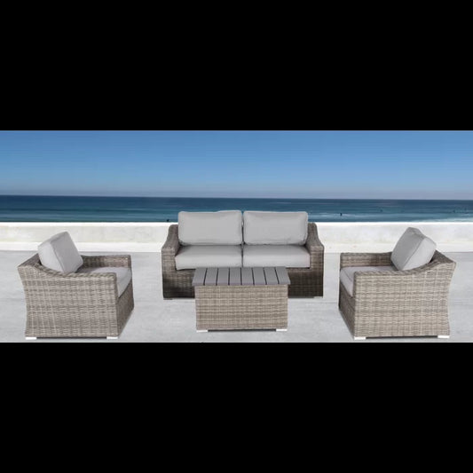 Grey wicker outdoor patio set with loveseat armchair and coffee table