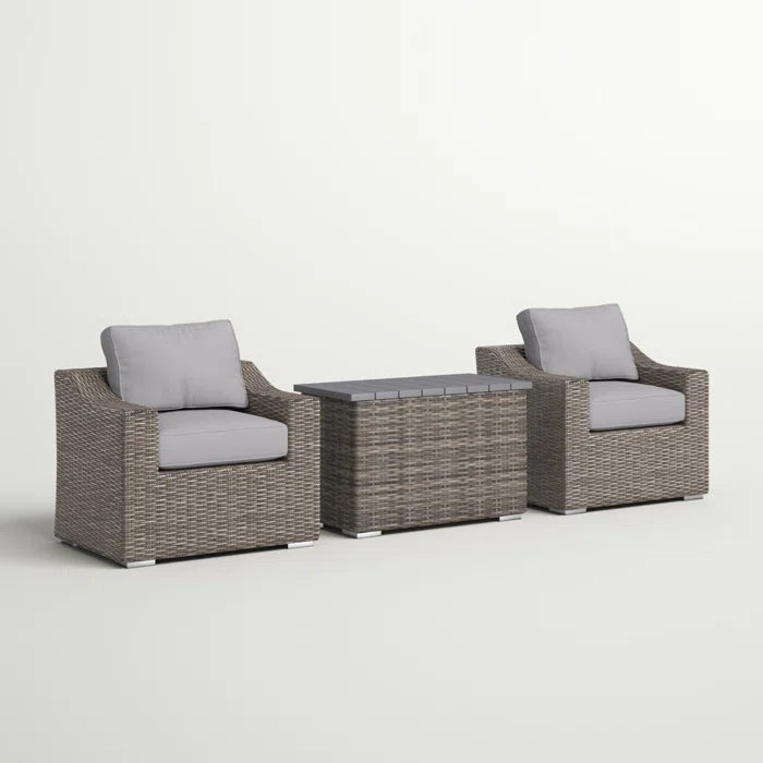 Grey wicker outdoor seating set with two armchairs and a storage coffee table