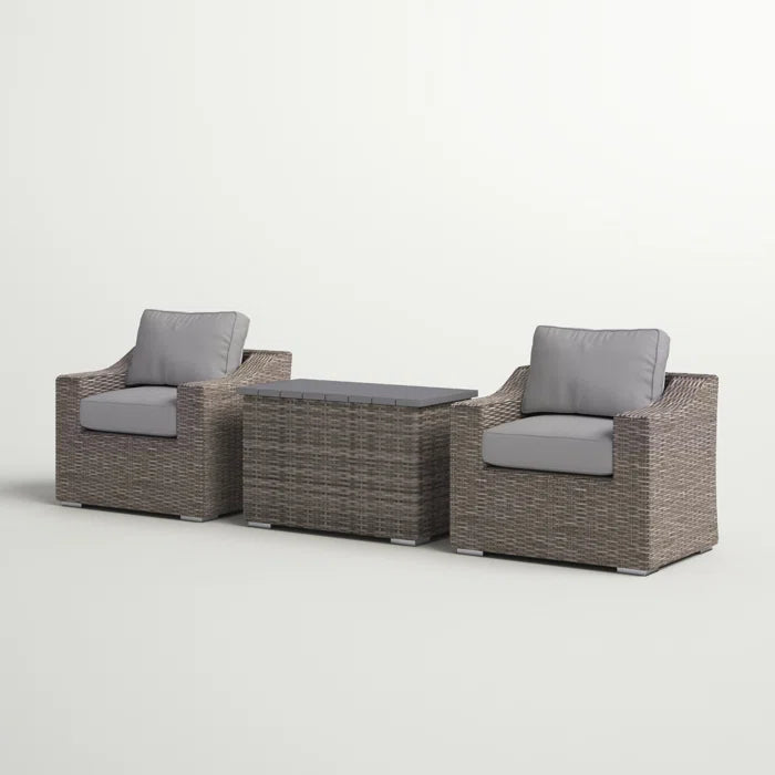 Two grey wicker armchairs and a matching coffee table with grey cushions