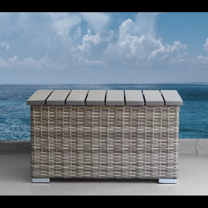 Gray rattan outdoor storage bench with slatted lid coastal style
