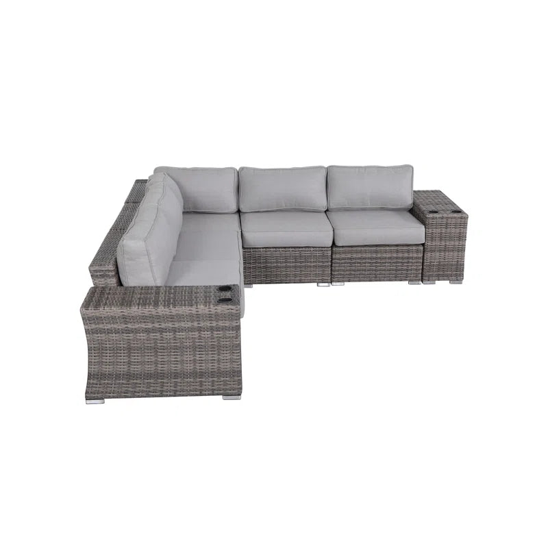 Grey wicker sectional sofa with builtin cup holders for outdoor seating