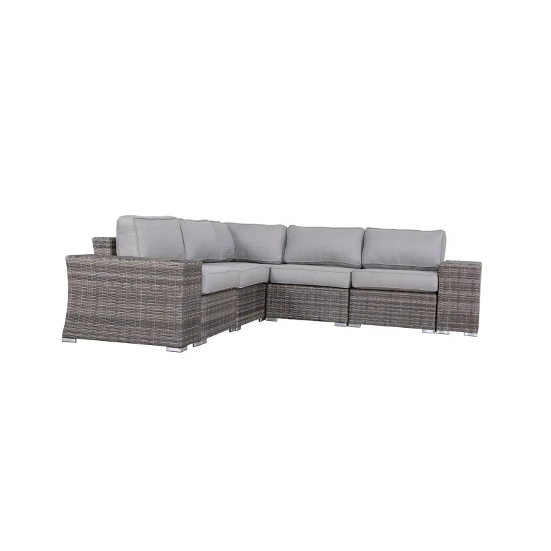 Gray wicker sectional sofa with plush light gray cushions ideal for outdoor patios