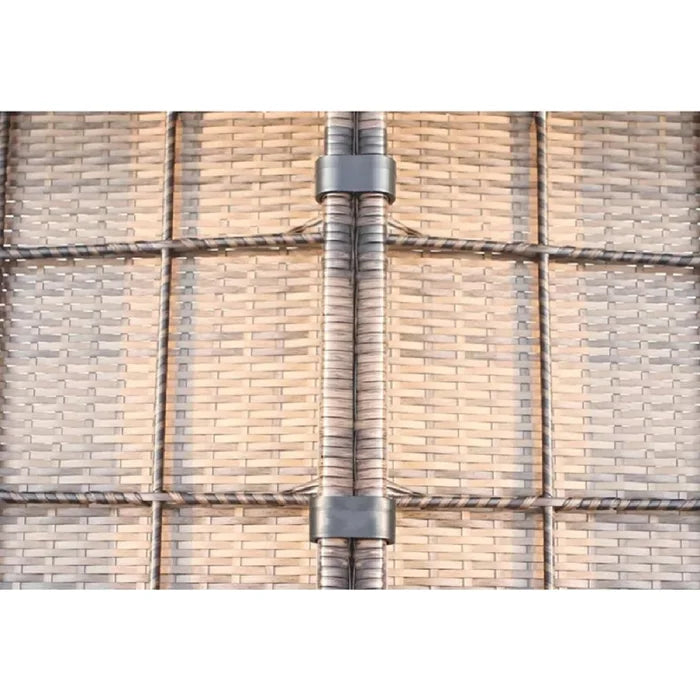 Closeup of woven wicker texture with connecting metal clamp