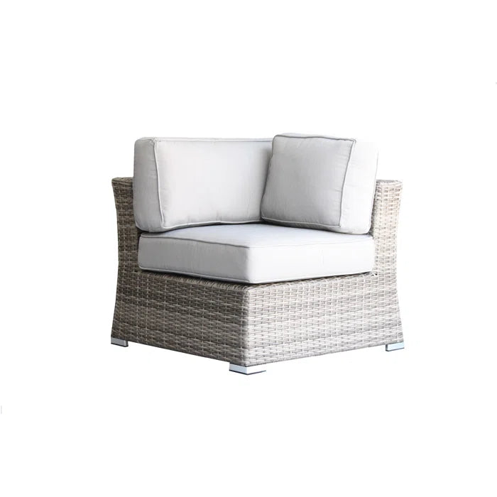 Grey wicker outdoor sectional corner chair with plush white cushions