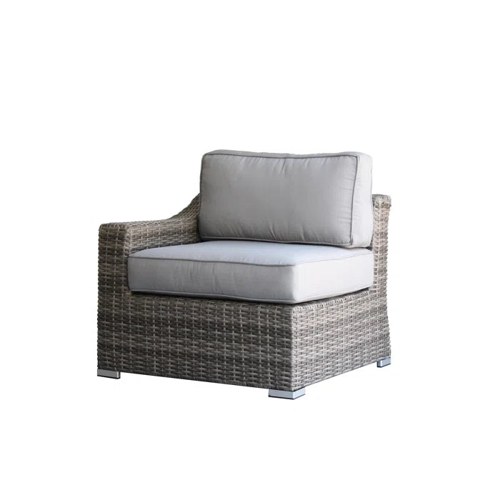 Grey rattan outdoor armchair with plush cushions for patio comfort