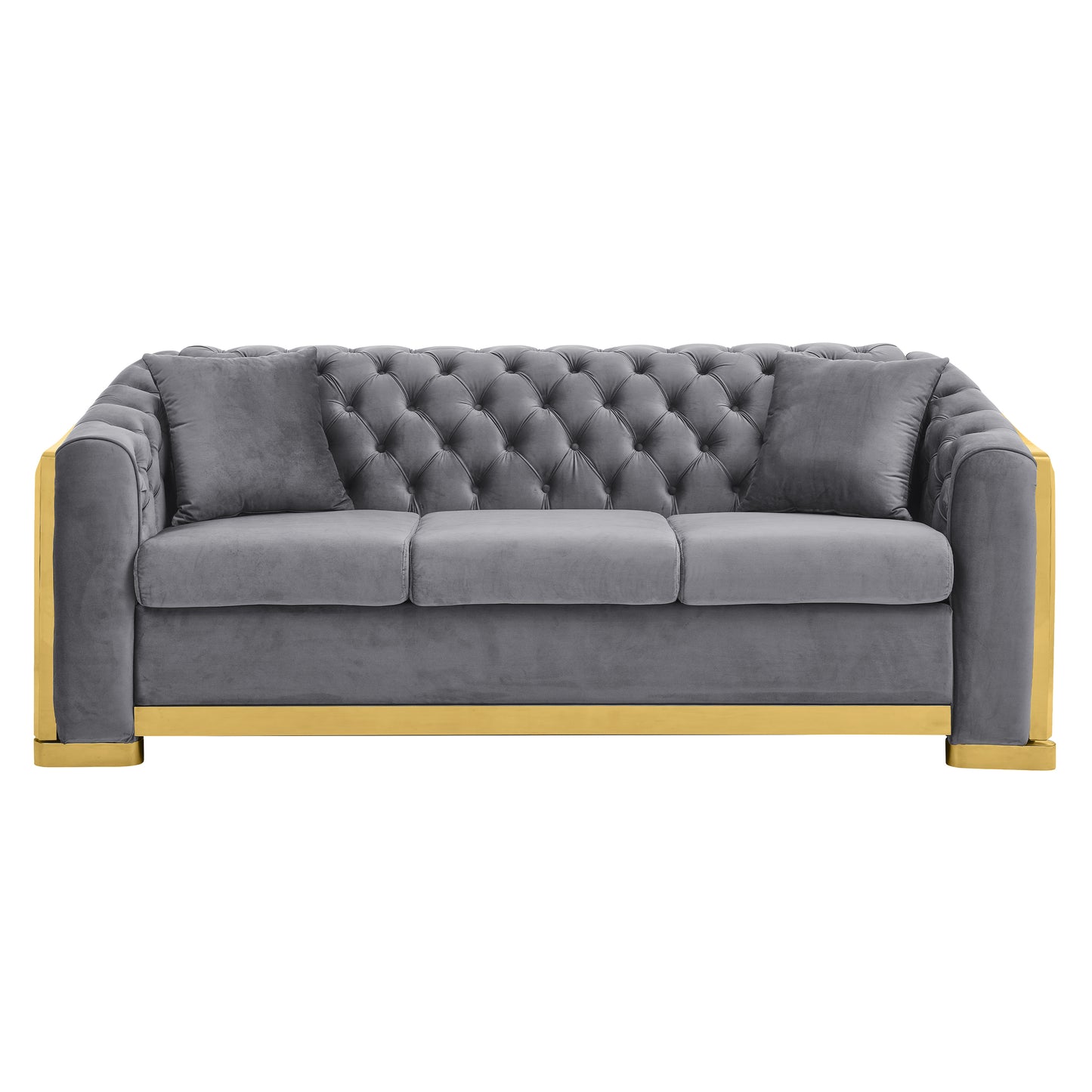 Grey velvet tufted sofa with gold accents and two accent pillows