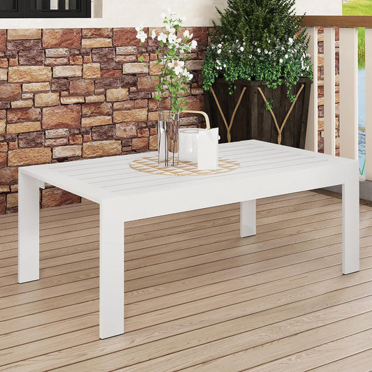 White rectangular outdoor coffee table with slatted top and modern legs on a wooden deck