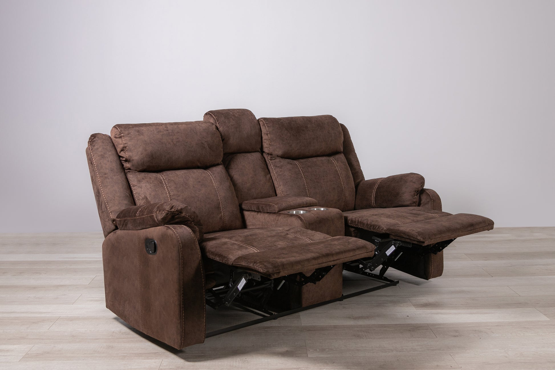 Brown fabric double recliner sofa with cup holders and plush cushions
