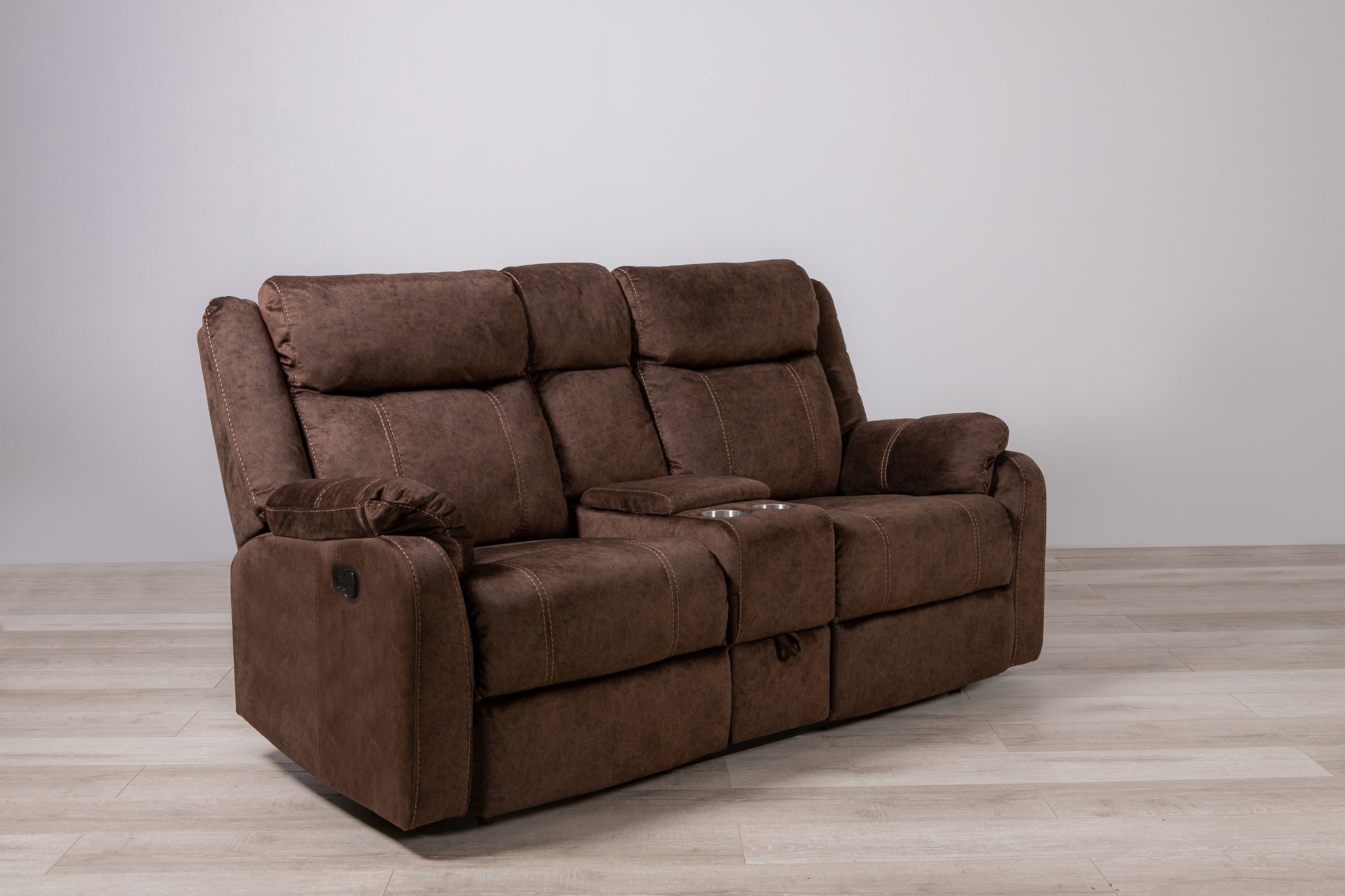 Brown microfiber dualreclining loveseat with cupholders and detailed stitching