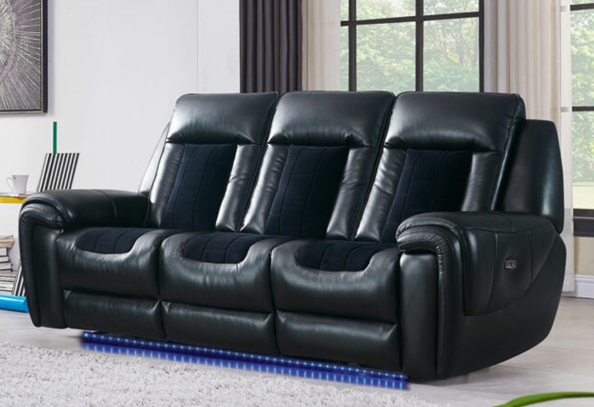 Black leather triple reclining sofa with plush navy blue fabric inserts and blue LED underglow lighting