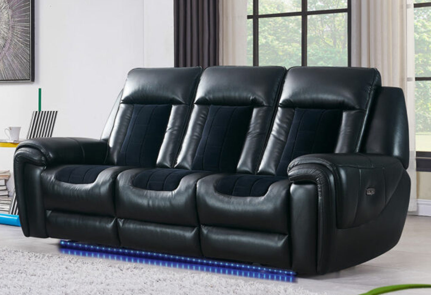 Black leather power recliner sofa with plush navy fabric inserts and adjustable lumbar support