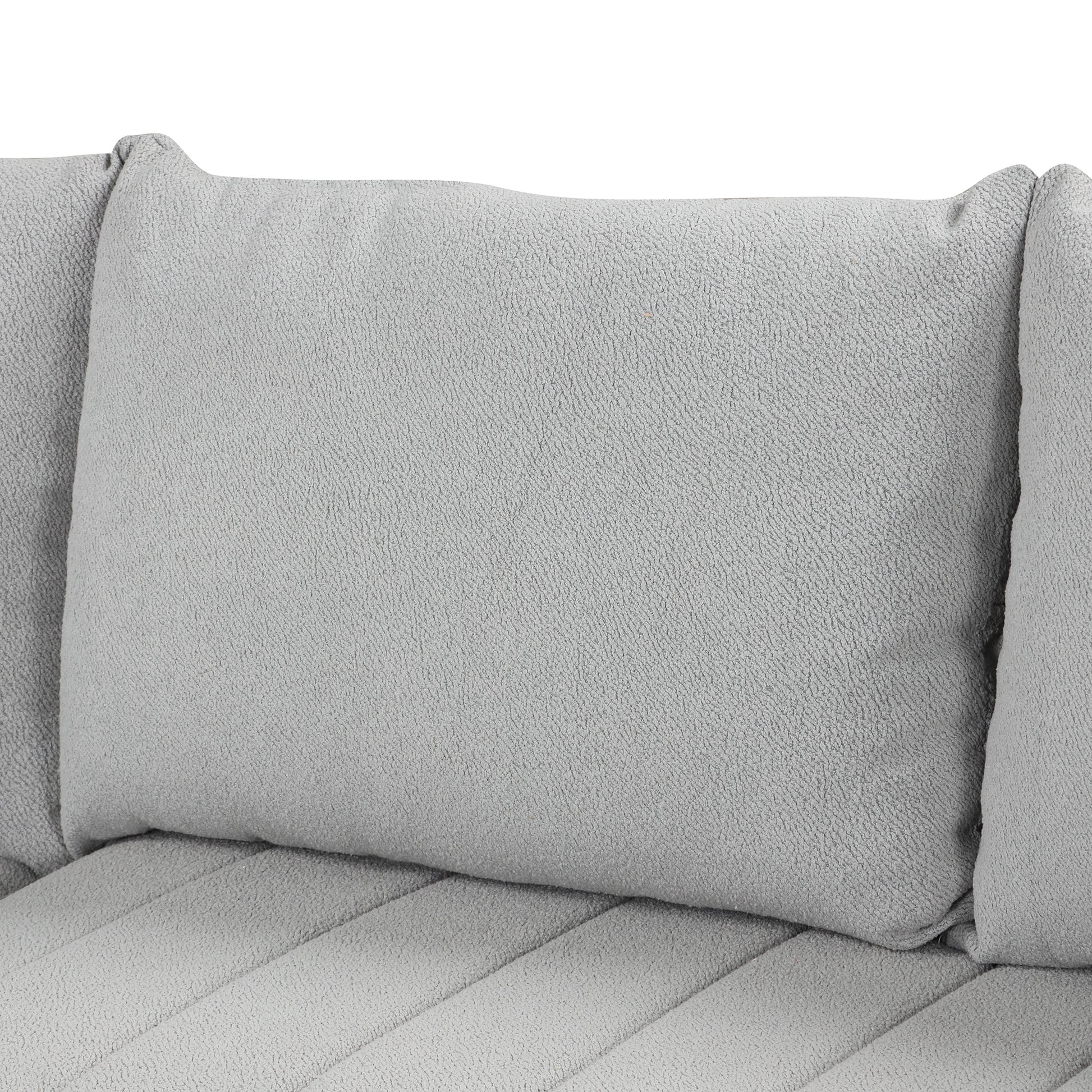 Soft grey textured sofa pillow with plush fabric and channel tufting for comfort