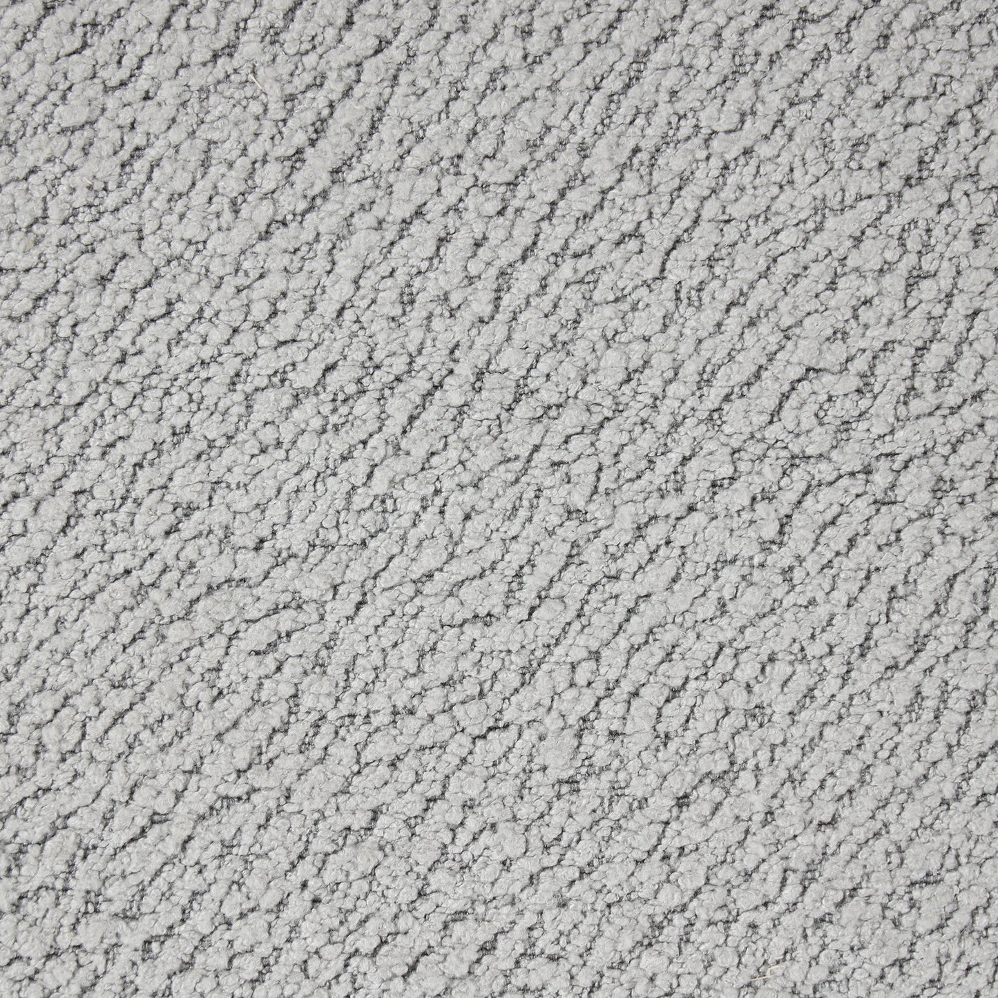 Closeup of textured light grey chenille fabric with a soft pile