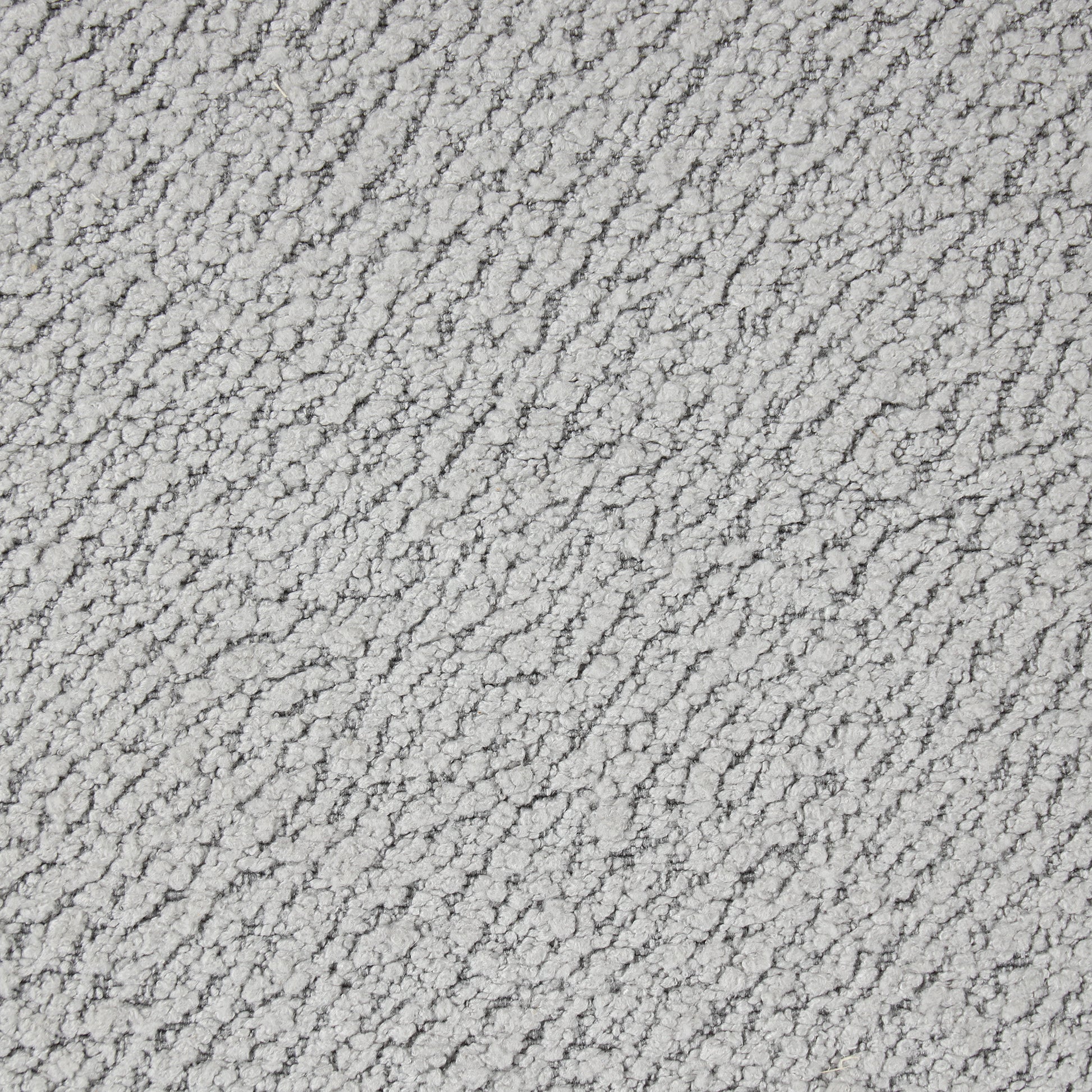 Closeup of textured light grey chenille fabric with a soft pile