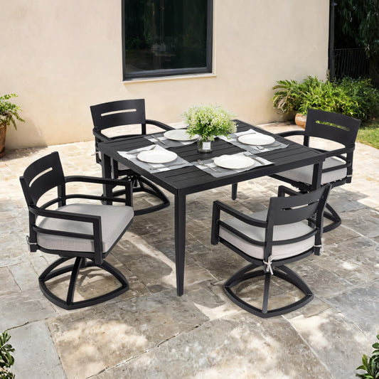 Black aluminum patio dining set with four swivel chairs and a square table